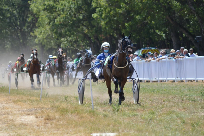 a horse race with riders on the back