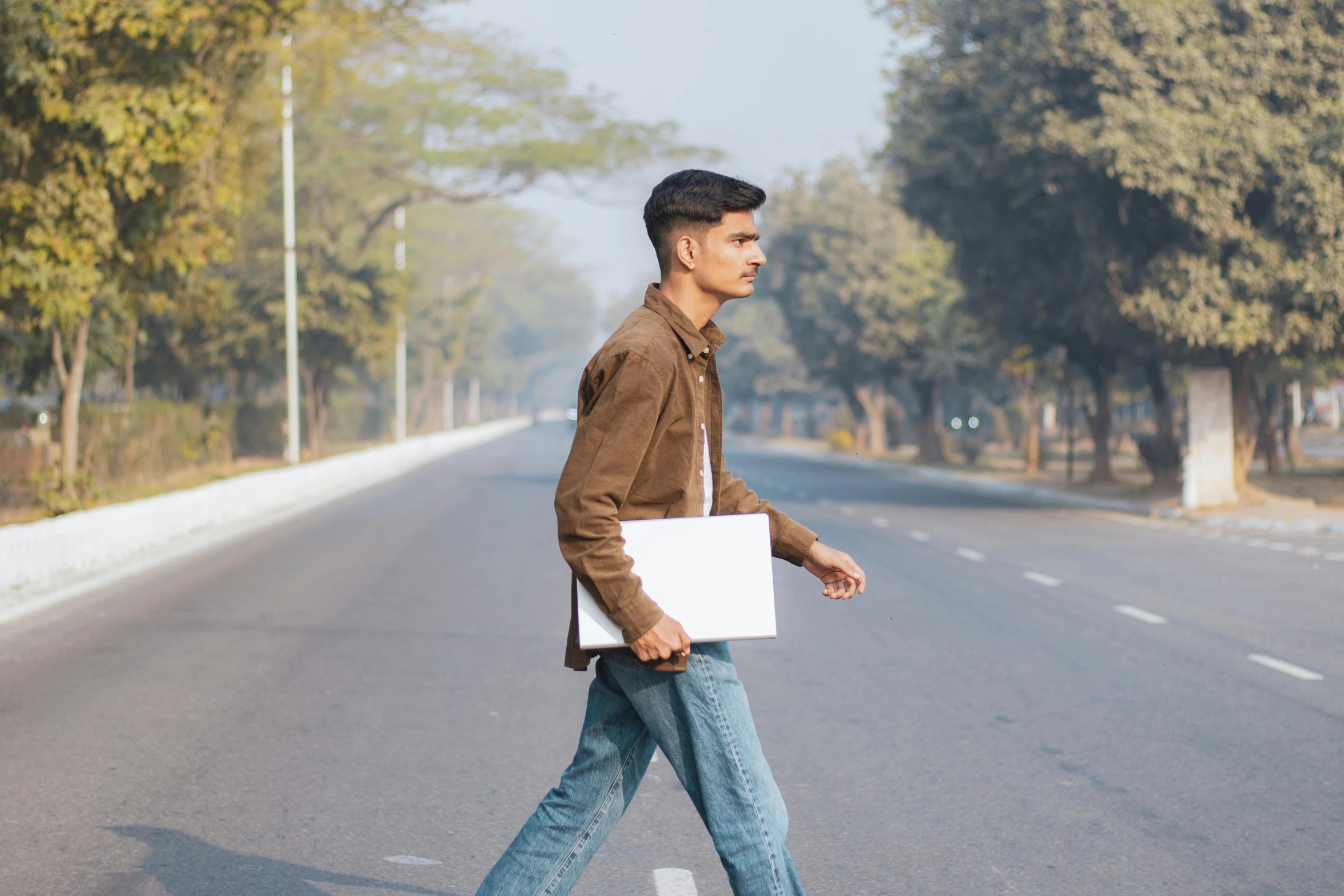 there is a man that is holding a white board