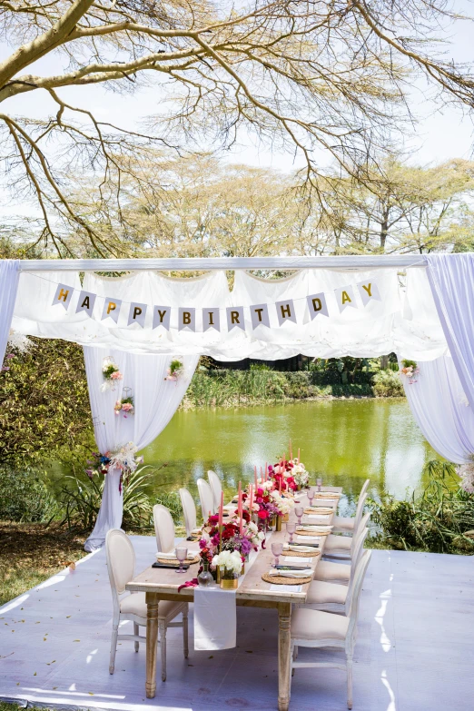 a backyard party with decorations and flowers