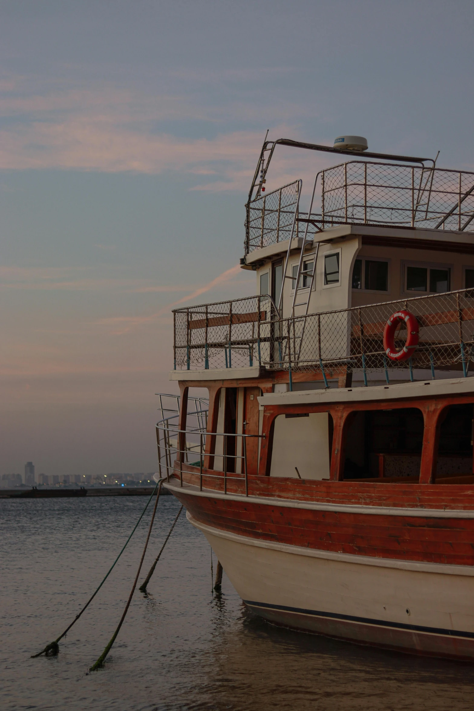 this is a boat with metal structure and railings on the deck