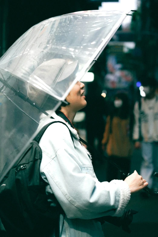 a person holding an umbrella over their head