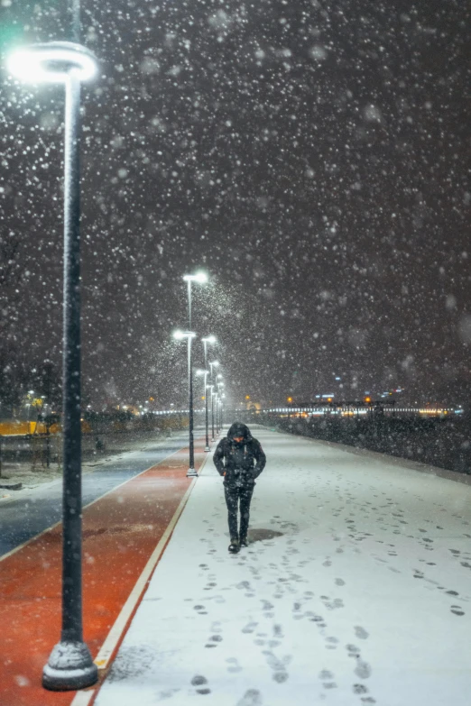 a person walking on the street in the snow