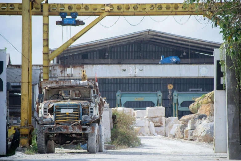 a dump truck parked in front of a building under construction