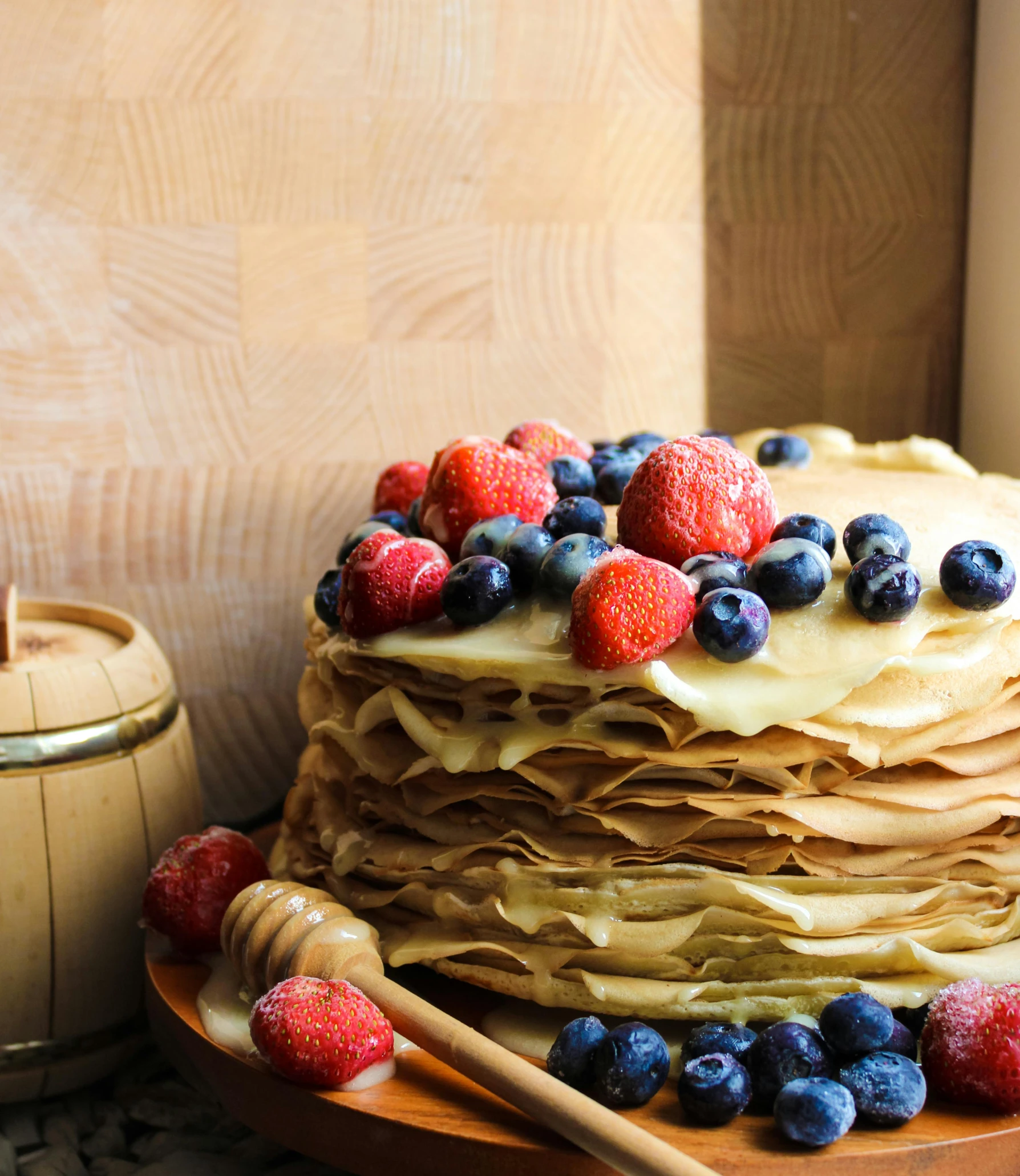 there is a cake with fruit and white frosting