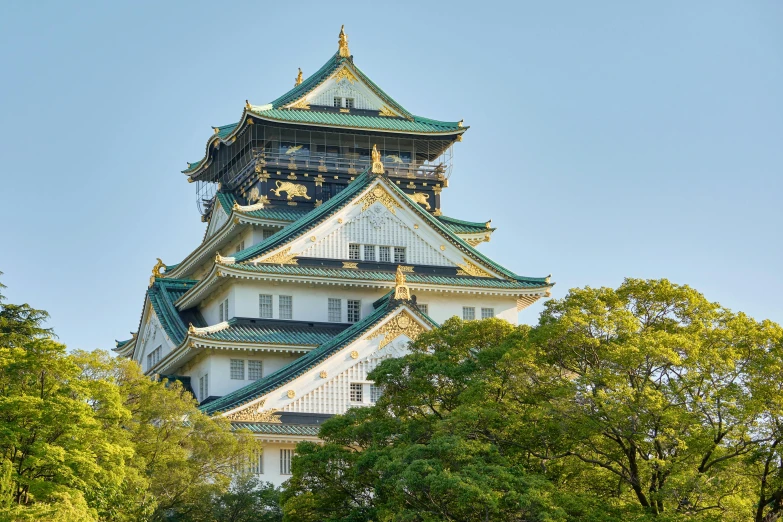 a tall building sitting next to some trees