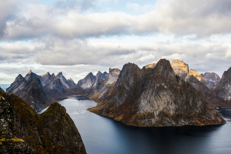 some mountains that have a lake and water