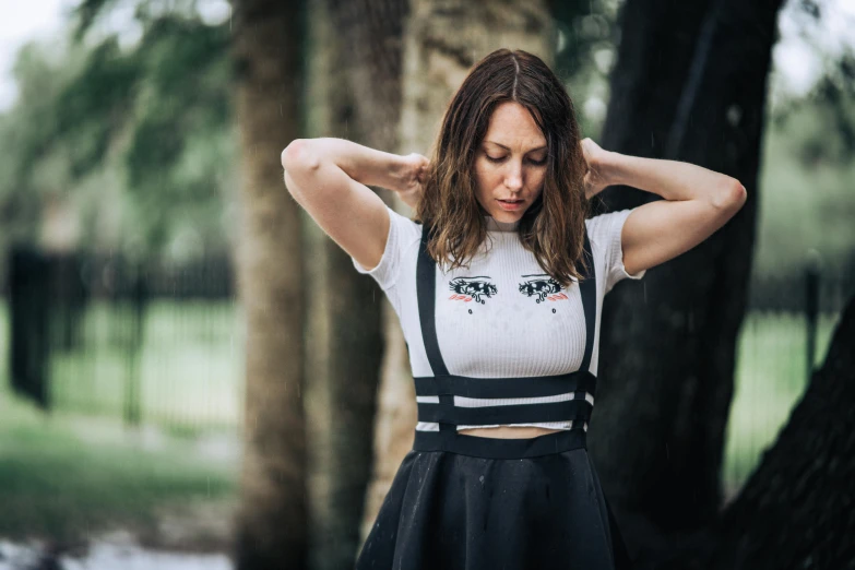 the young woman is wearing black and white clothing