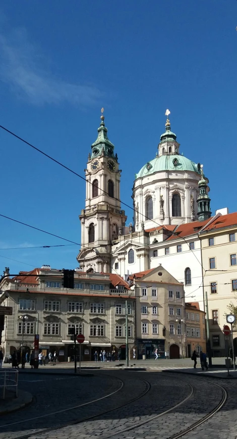 buildings and blue sky and tracks in a square