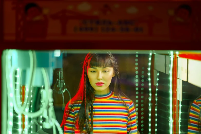 girl standing in the middle of a room with multiple items