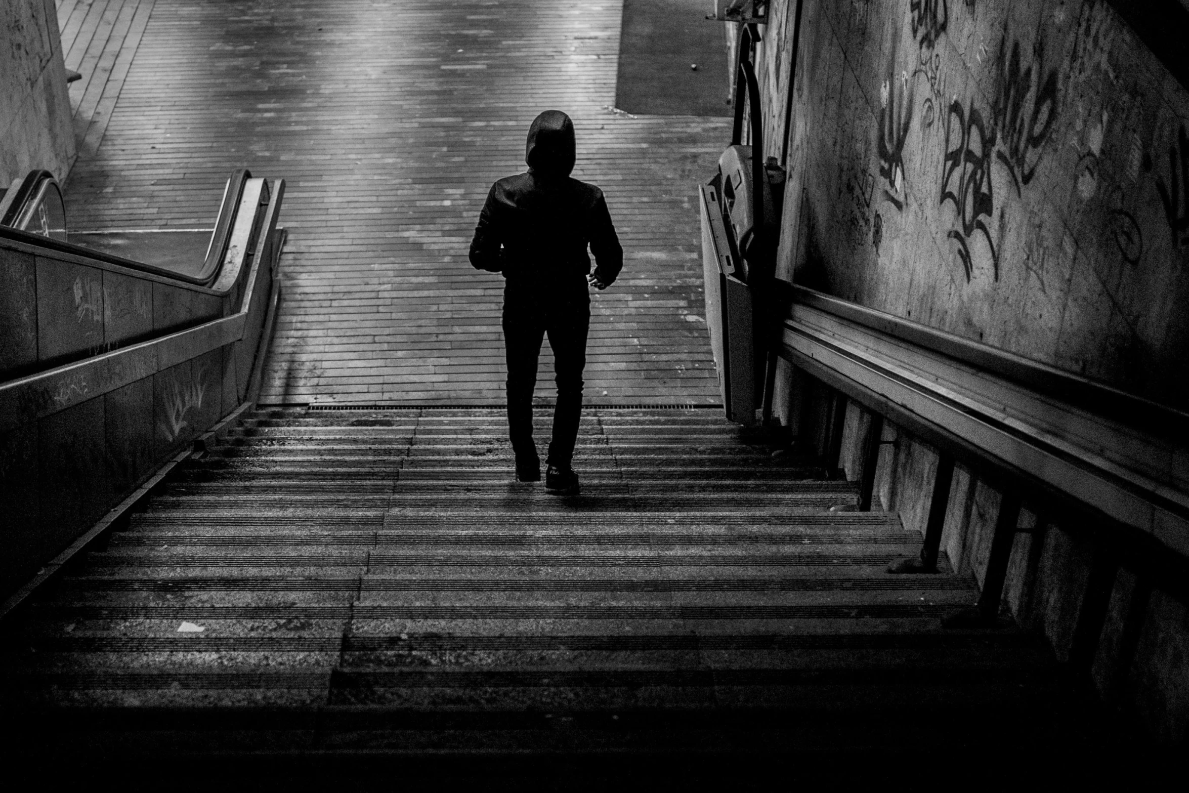 a person standing on a stairwell in a building