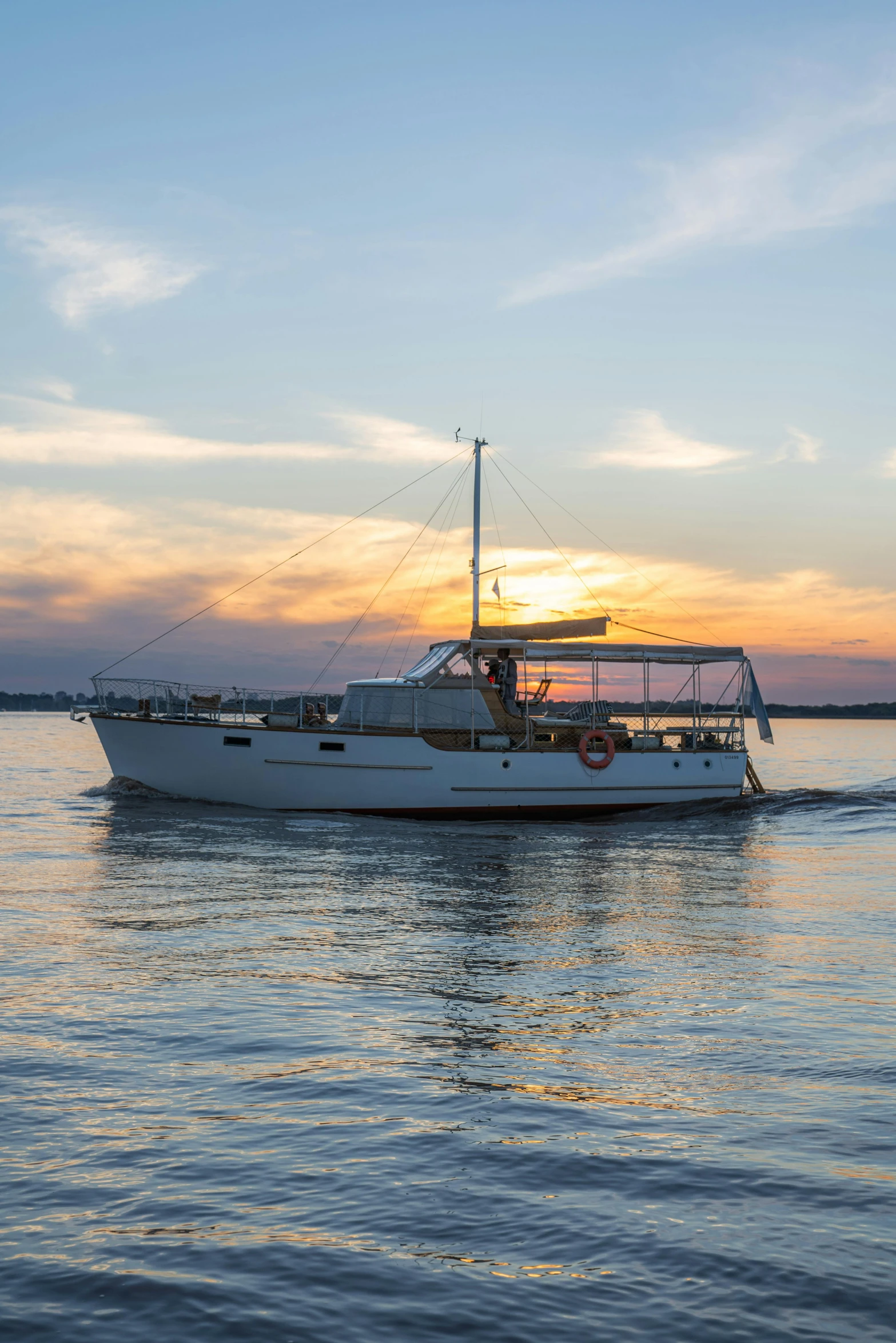 a boat in the water at sunset or sunrise