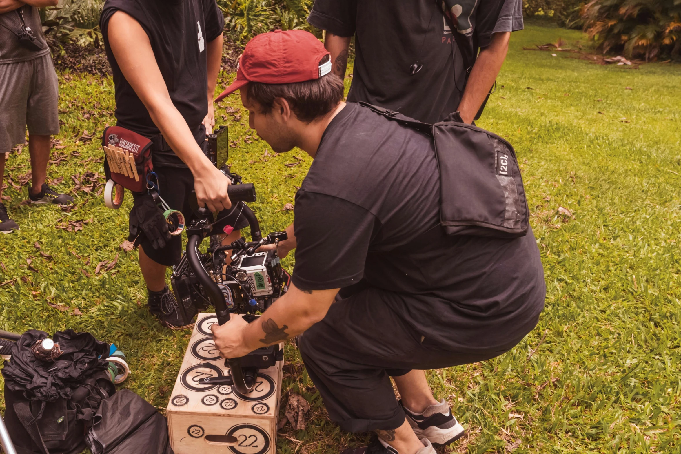 people in uniform are around a projector on a lawn