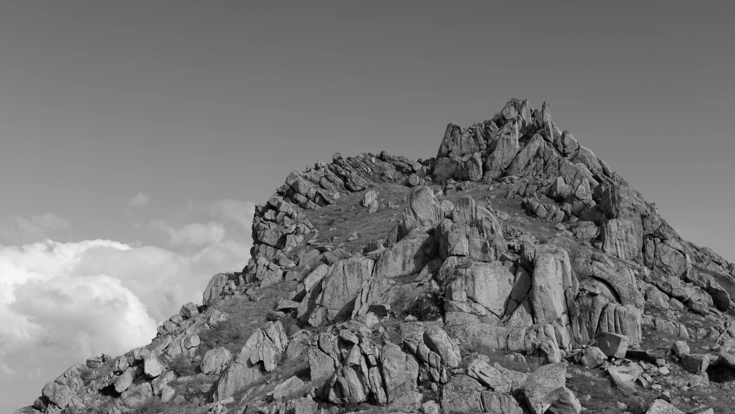 a black and white po of an old rock mountain