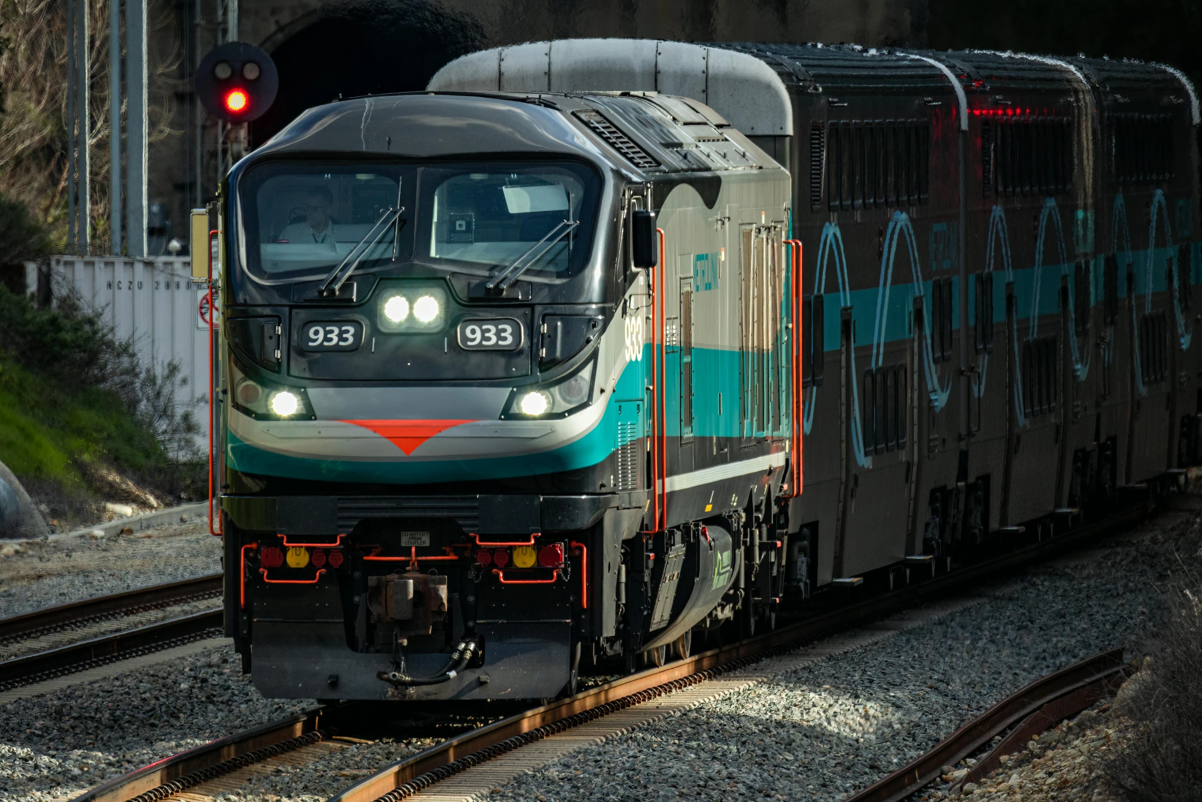 a train going through a tunnel with lights on