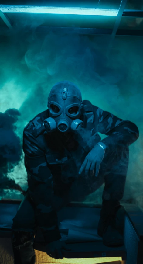 the image shows a man in a gas mask