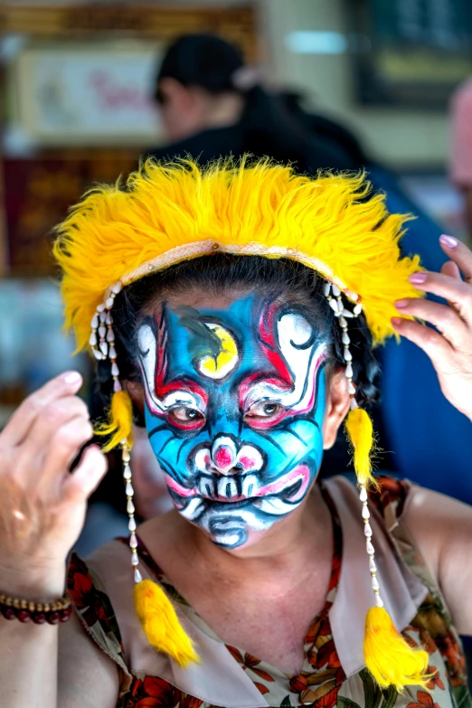 a young person with paint painted on his face