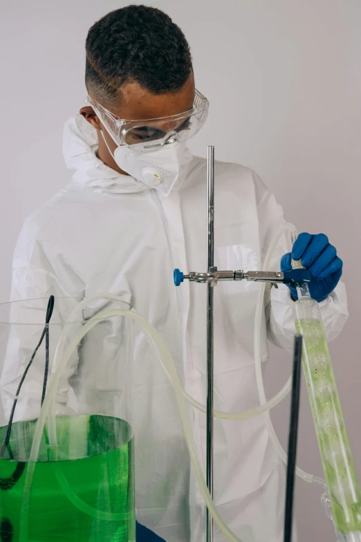 a scientist wearing safety equipment in a lab