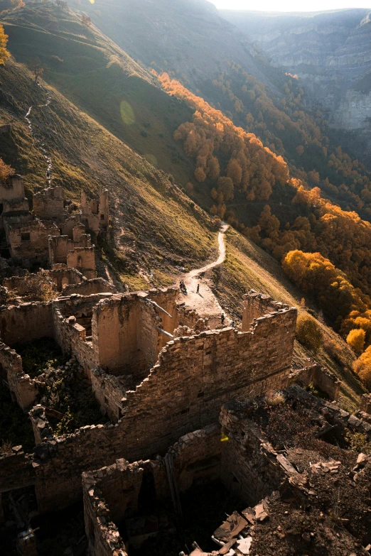 an aerial s of a ruin in a mountain side