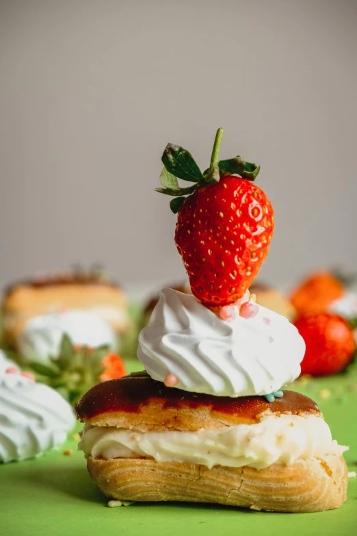 there is a strawberry on top of the pastries