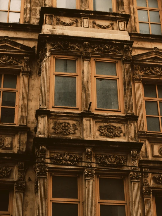 old window with ornate carvings on the outside