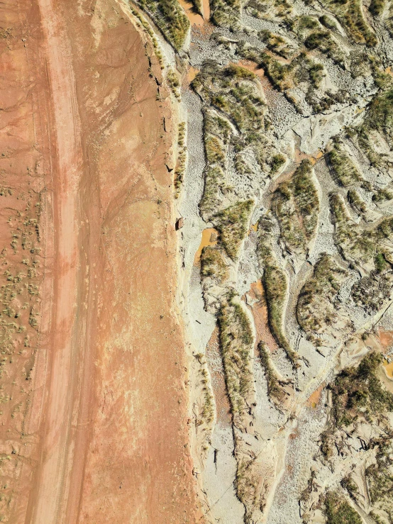 aerial view of tire tracks on a dirt surface