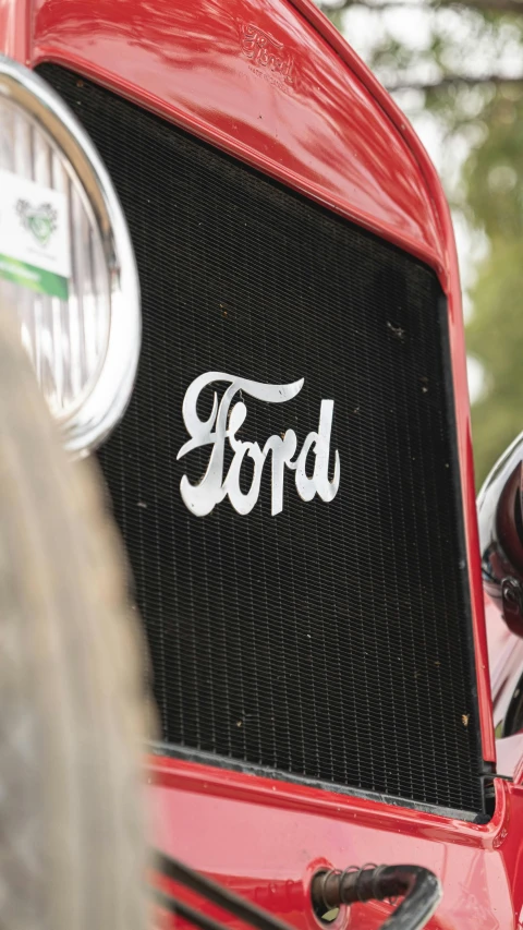 close up of an old car with the ford logo on it