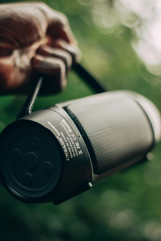 there is a man holding out his hand with a cup on the handle