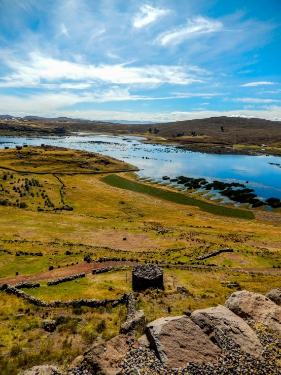 a view from top of a hill overlooking a lake and a river