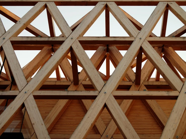 the roof beams of a wooden structure are very low hanging