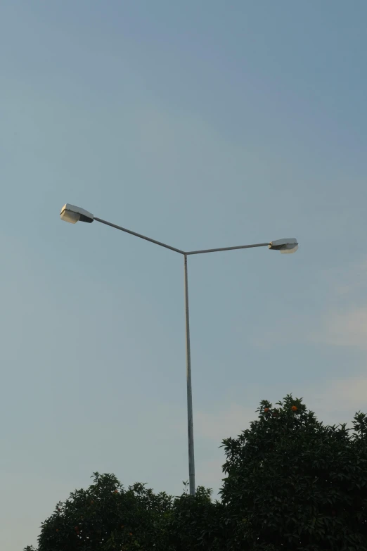 two light street lights on top of the pole