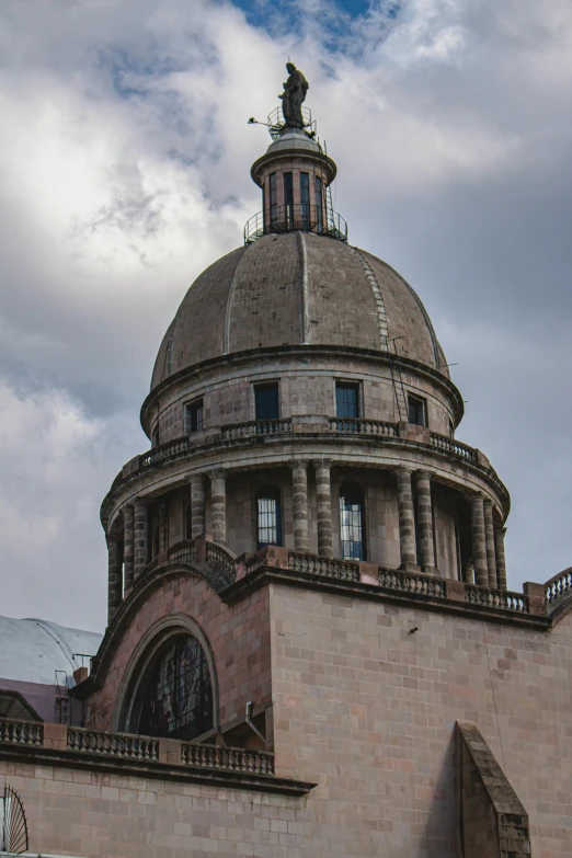 the dome top of an old brick building