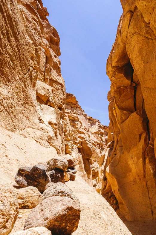 two huge rocks on the side of a mountain