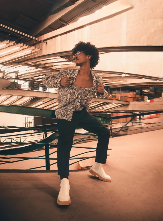 young male performing a dancing trick on top of steps