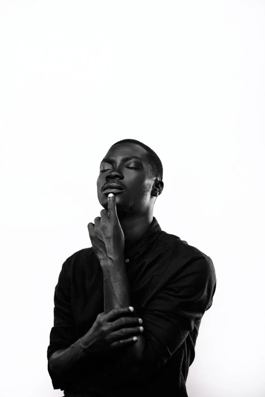 a black and white po of a man praying