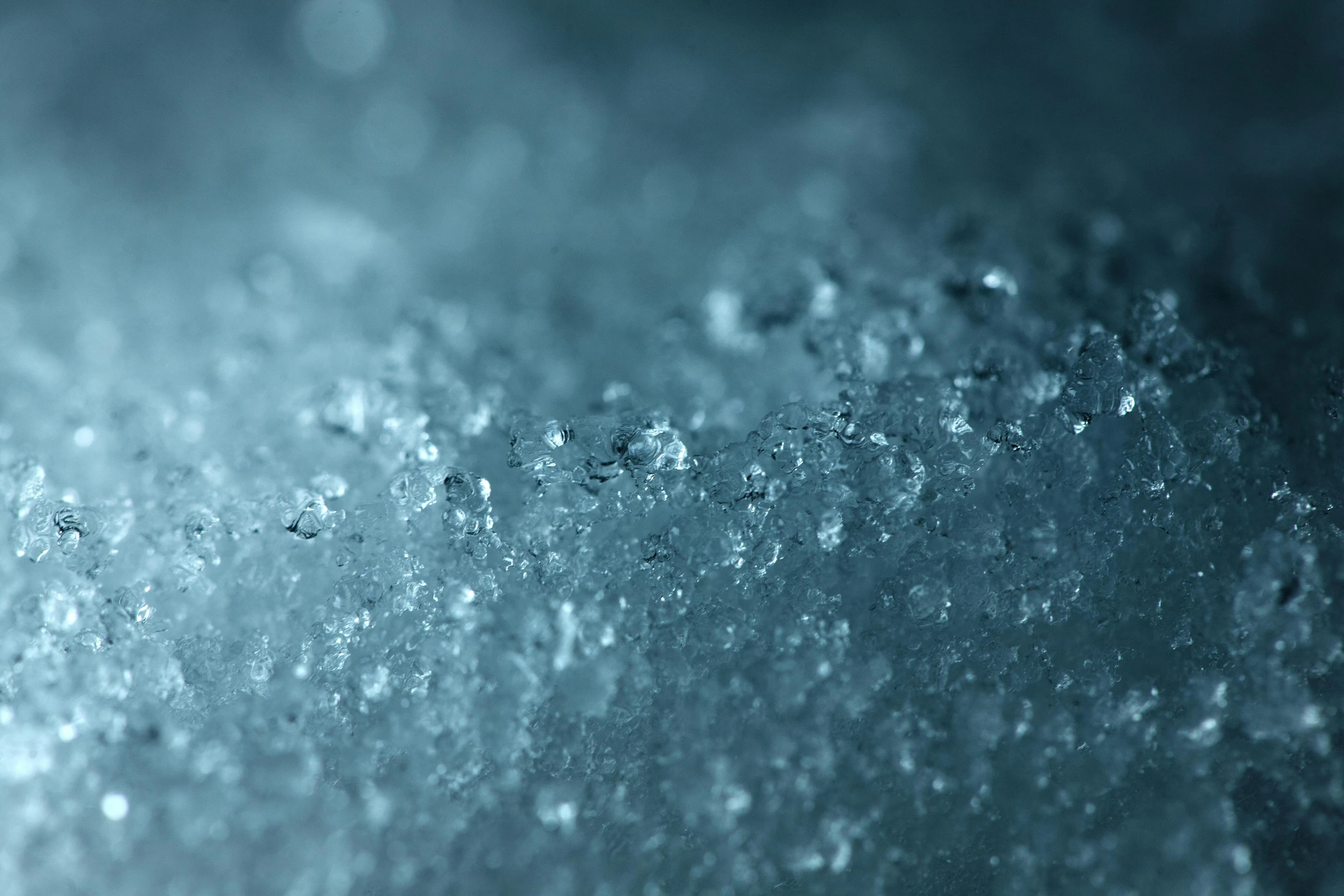 a blue abstract background with several bubbles in the middle