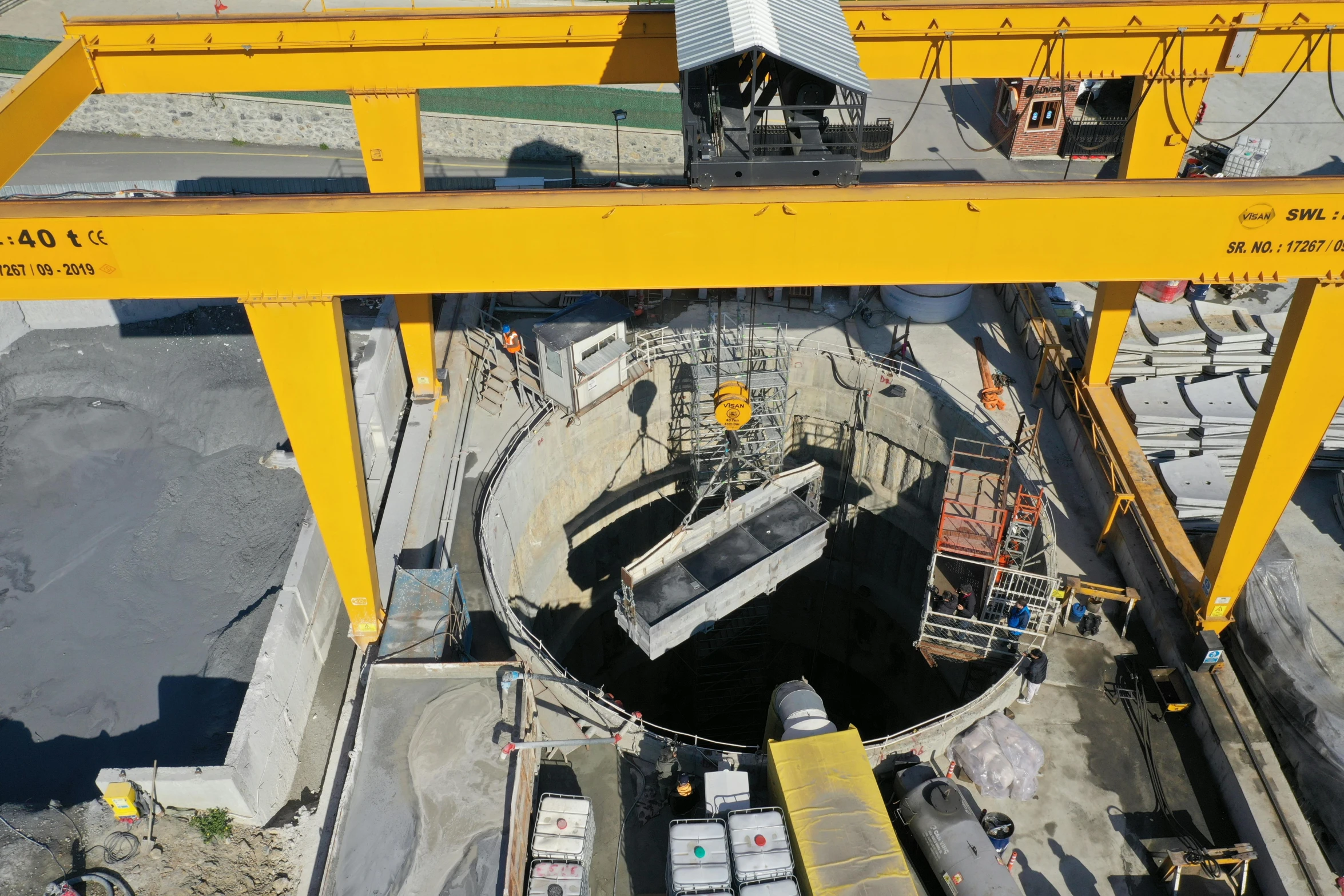 a large yellow crane on top of a building