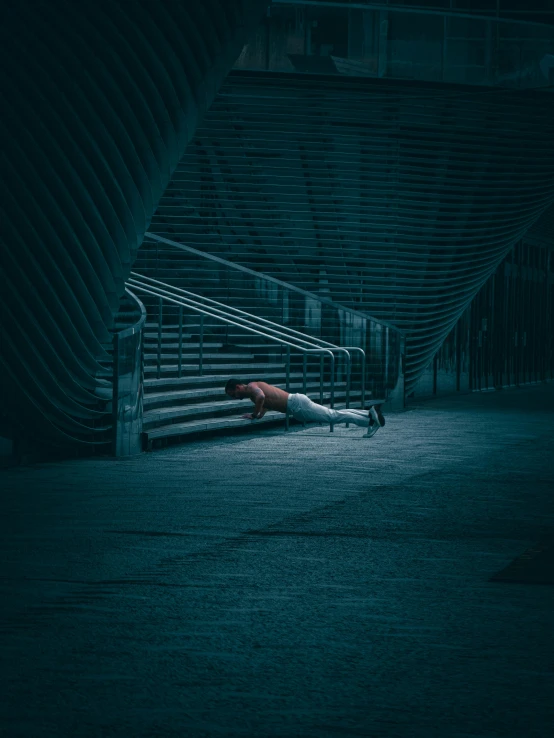 person on a stairwell, in dark tunnel with no pants