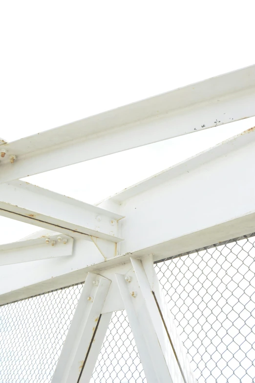 an old fence in front of a white building