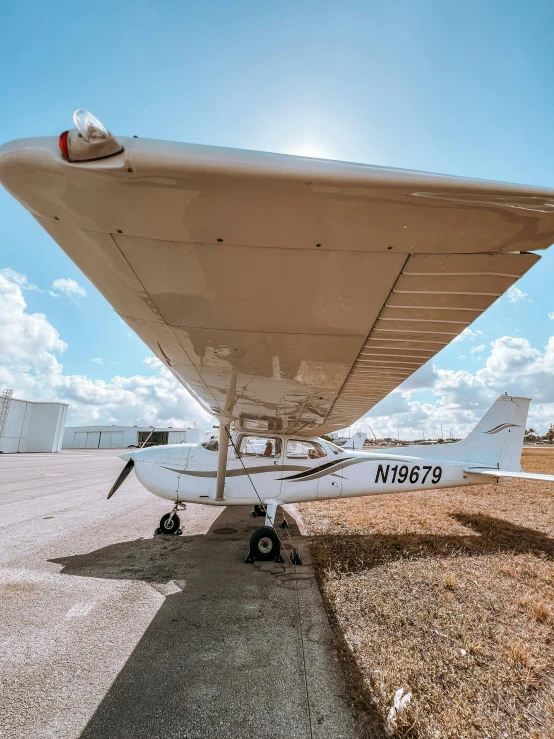 small prop airplane sitting on top of a tarmac