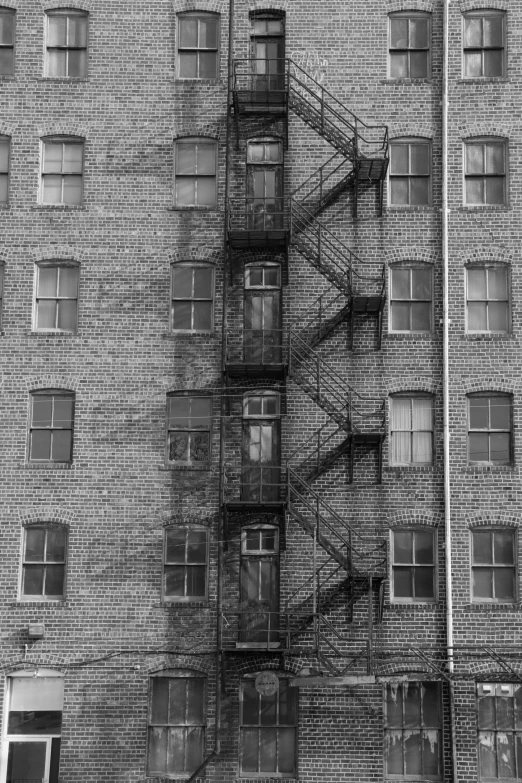 a fire escape next to an empty building