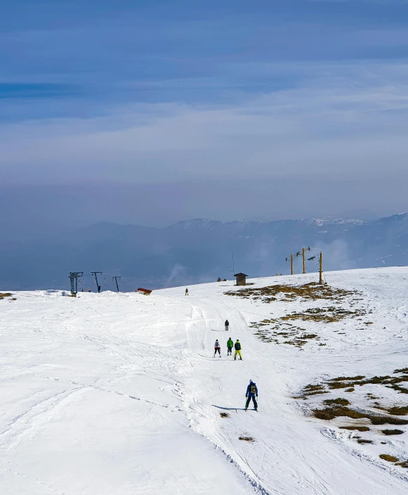 people skiing on a snowy mountain in the winter