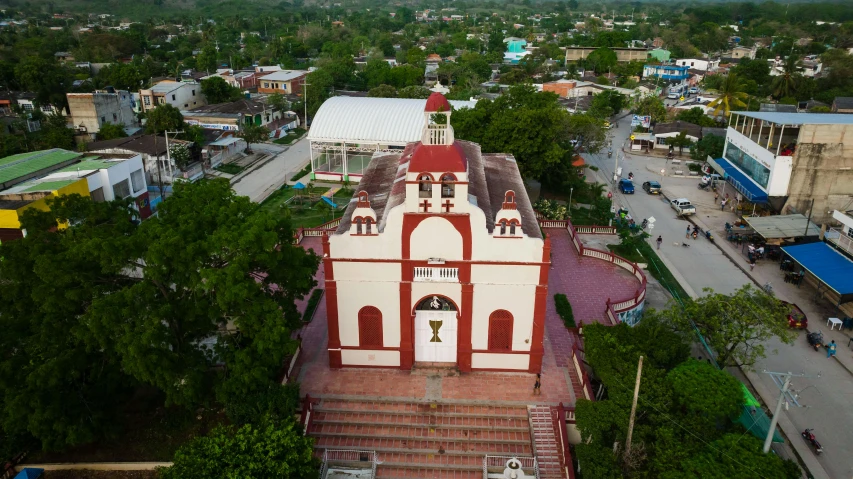 an aerial view of a church and surrounding streets