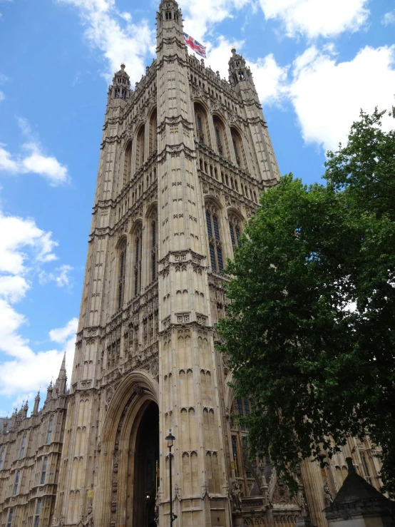 the tall building has a clock tower in it's center