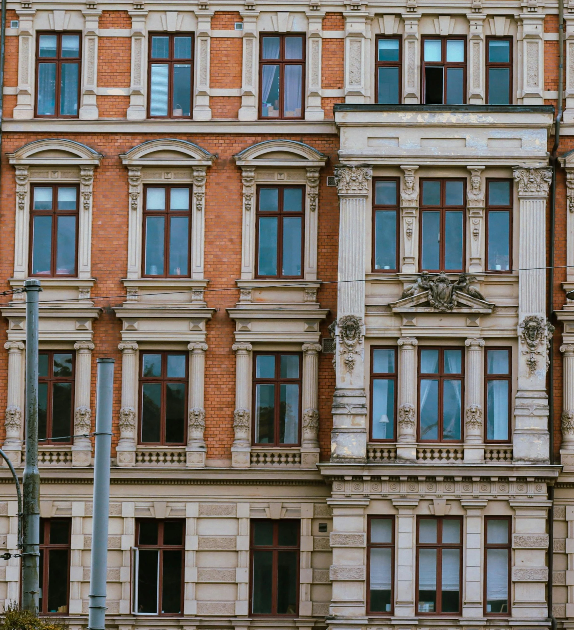 the facade of an apartment building, with multiple windows and windows