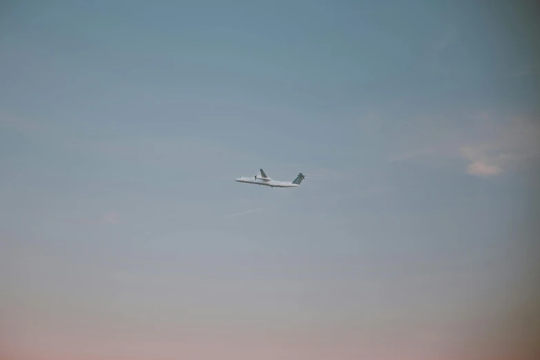 an airplane is seen flying low over an open field