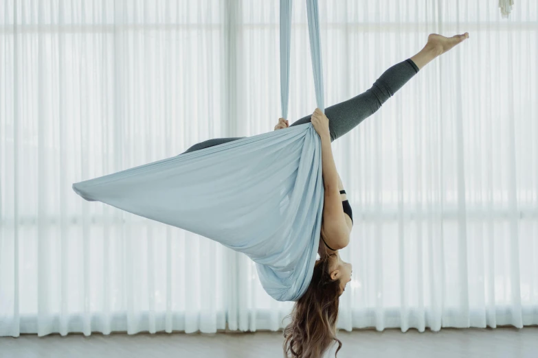 a person is hanging from a chair