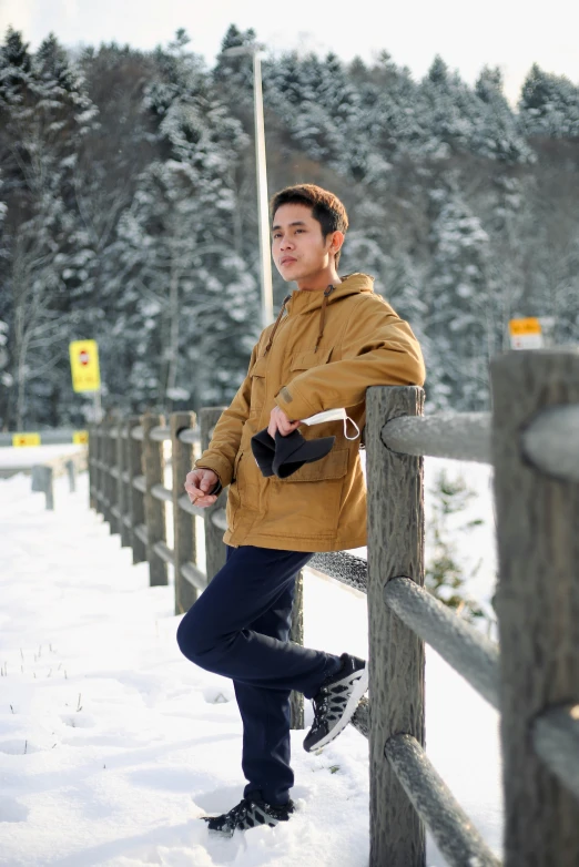 a boy posing for the camera in winter