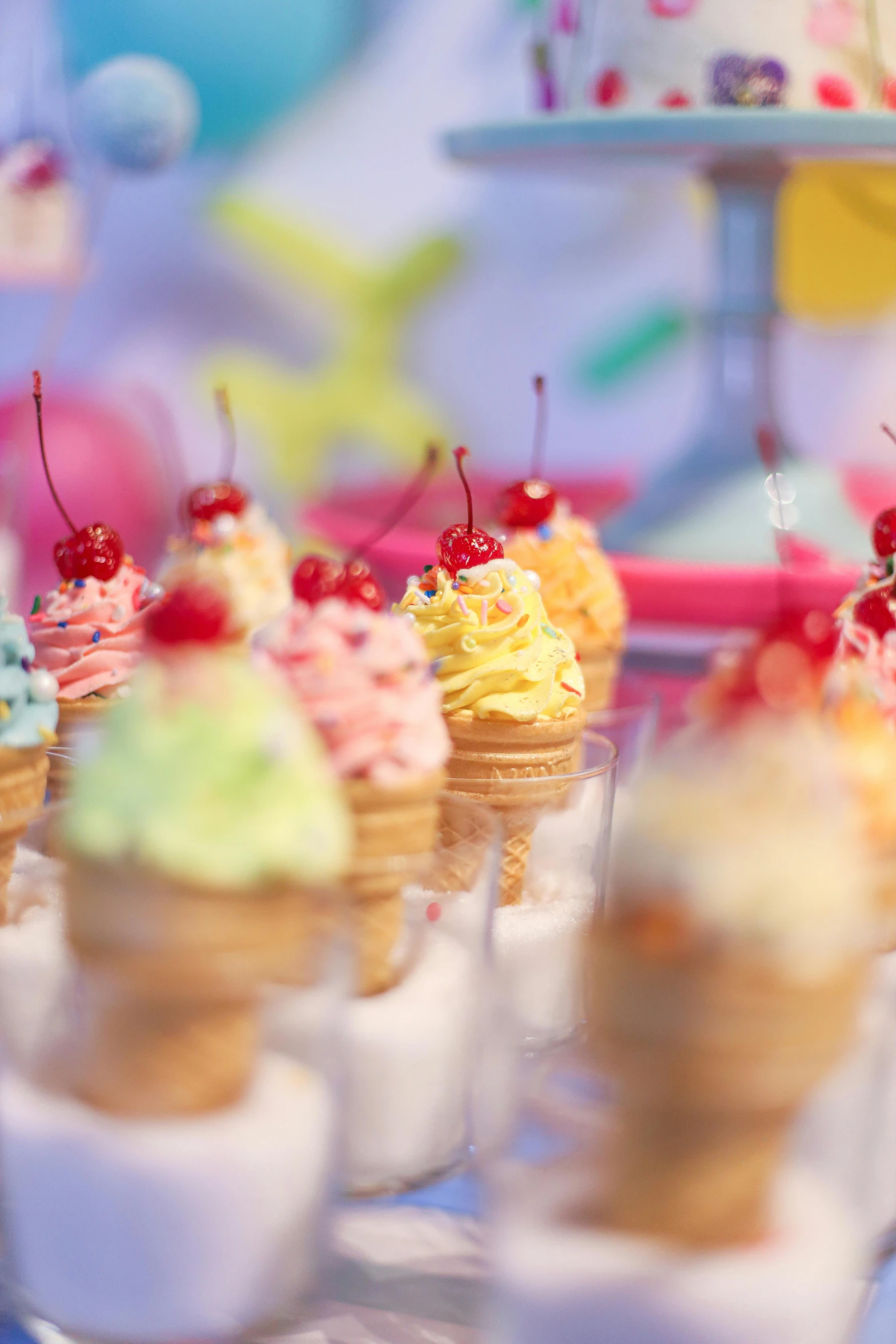 some tiny cupcakes are lined up in a row