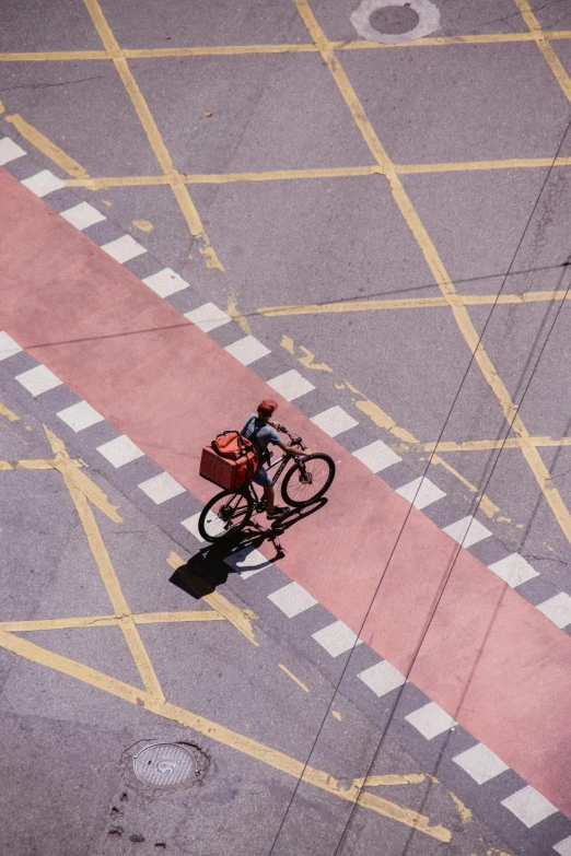 a person riding a bicycle down a street