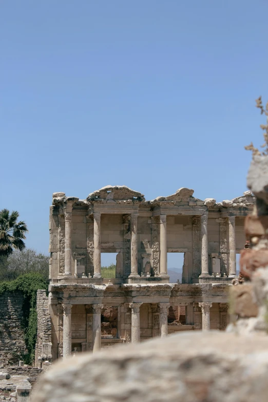 an old building with many columns and arches